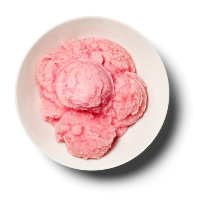 a white bowl filled with pink ice cream