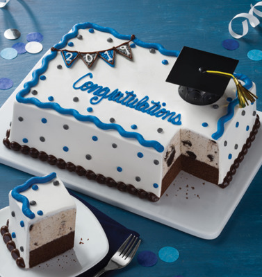 a graduation cake with a piece missing from it