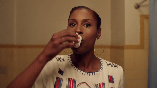 a woman brushing her teeth in a bathroom