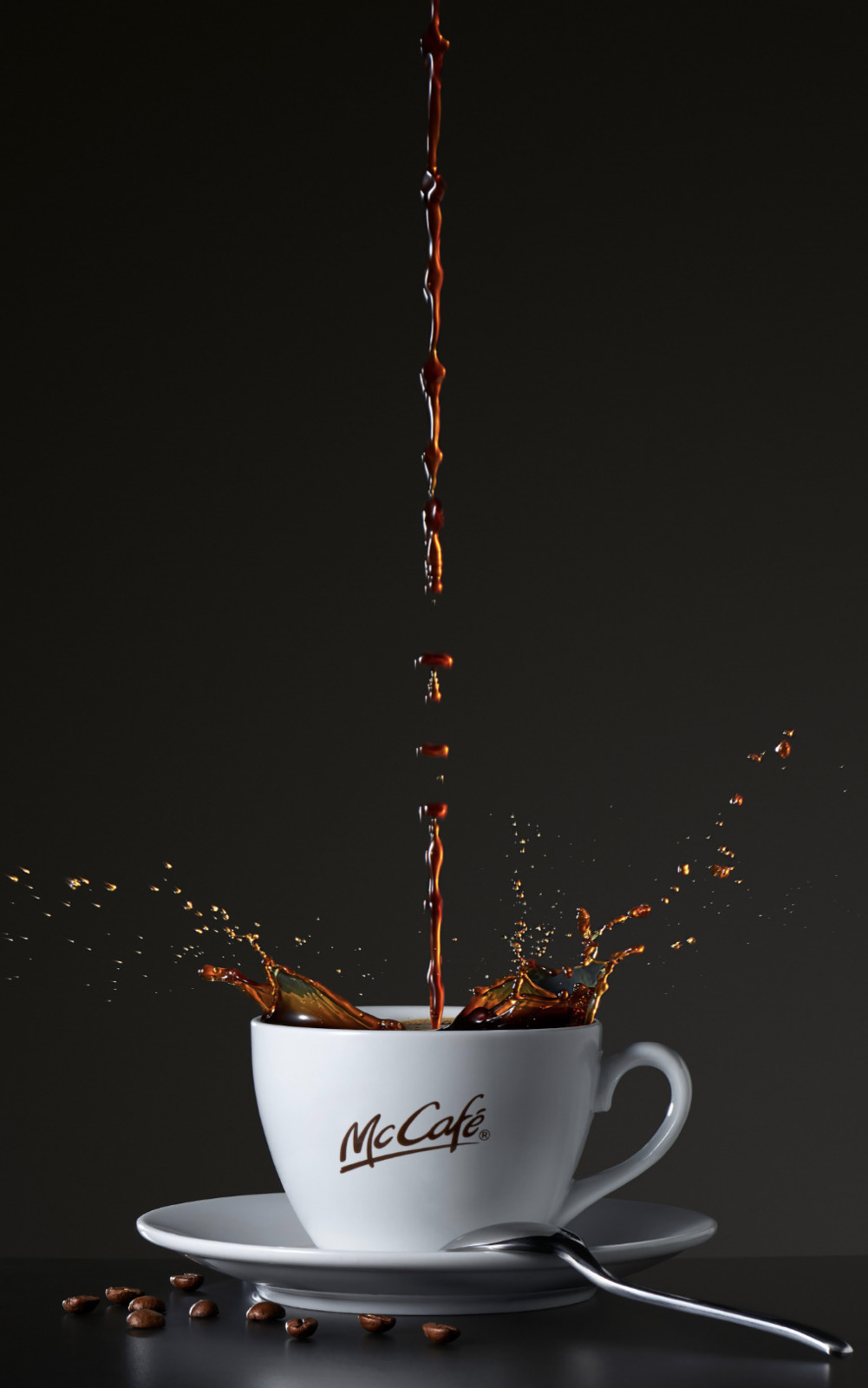 a cup of coffee being poured into it