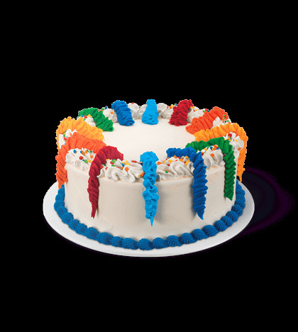 a white cake with multicolored icing on a plate