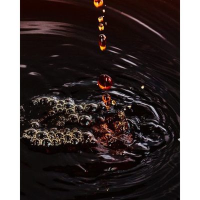 a group of bubbles floating on top of a body of water