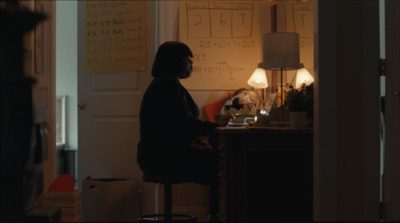 a person sitting at a desk in a room