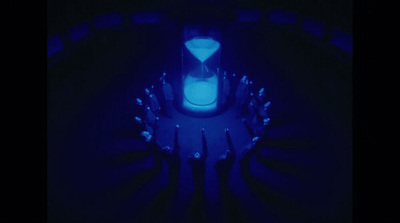 a group of people standing in a dark room