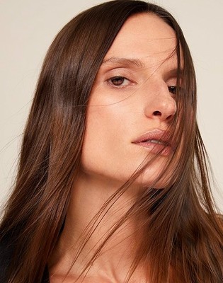 a close up of a woman with long hair