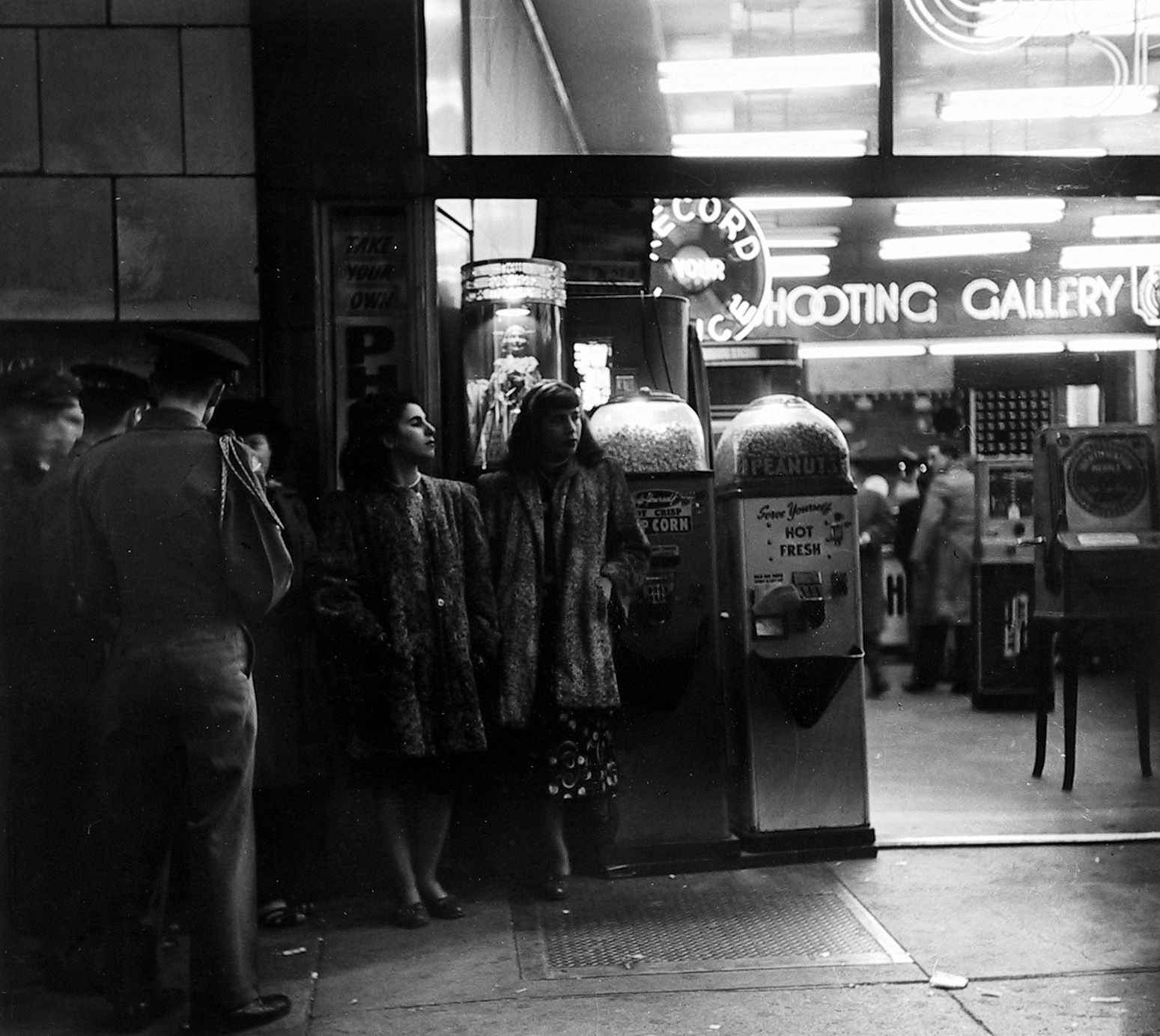 a group of people standing outside of a building