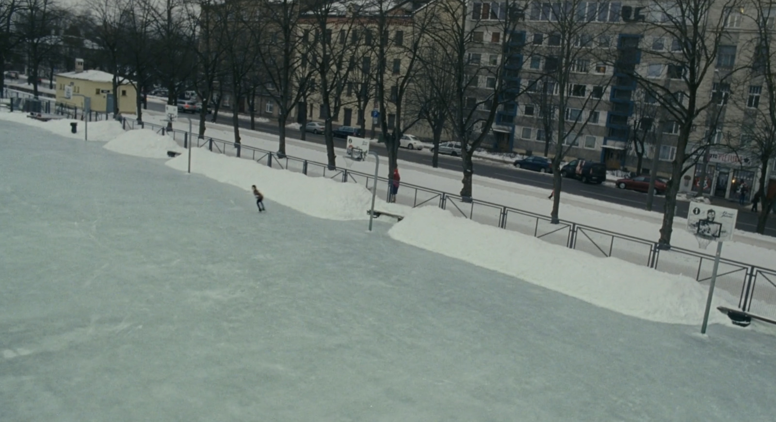 a man riding a snowboard down a snow covered slope