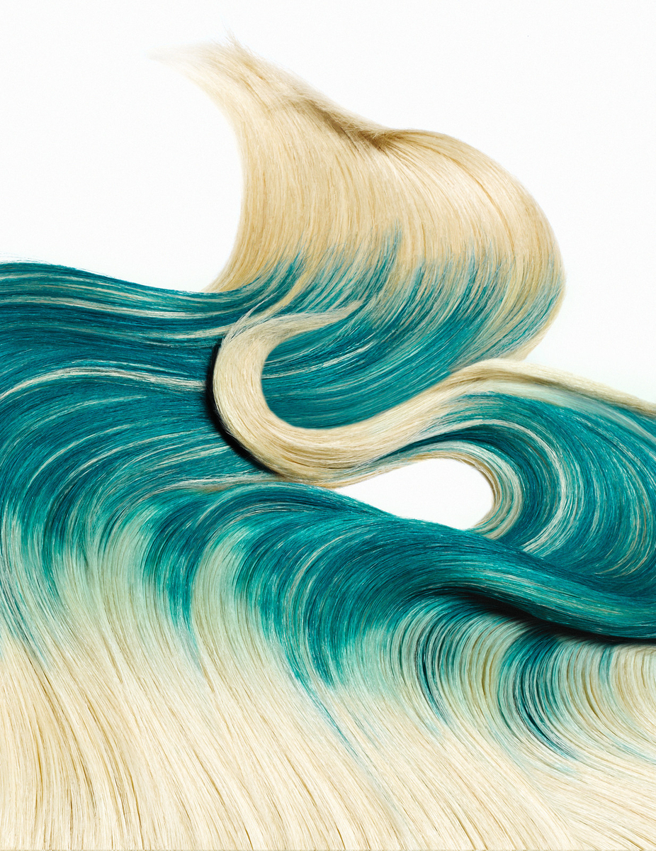 a close up of a wavy blue and white hair