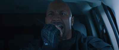 a man in a car with his mouth open