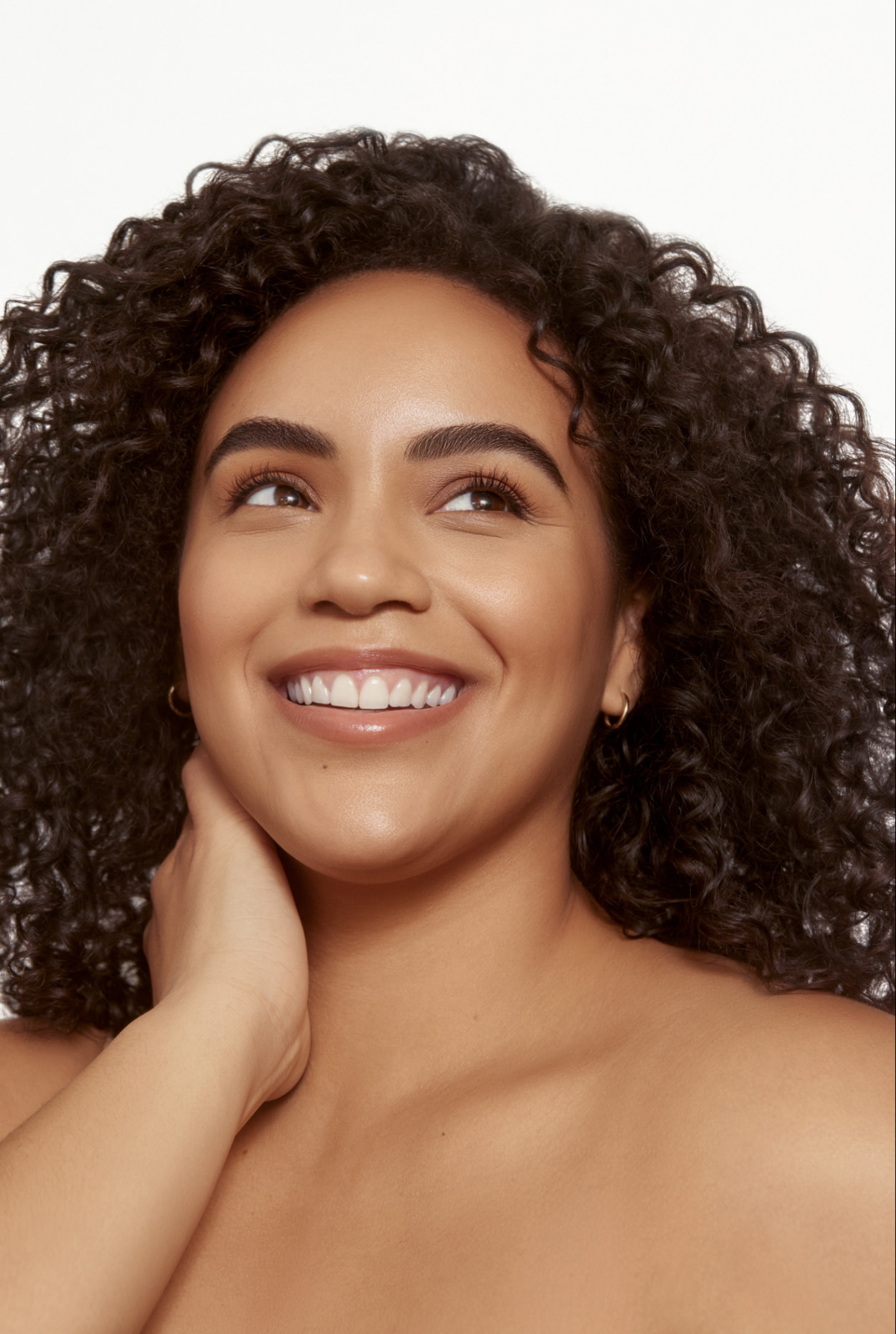 a close up of a person with curly hair