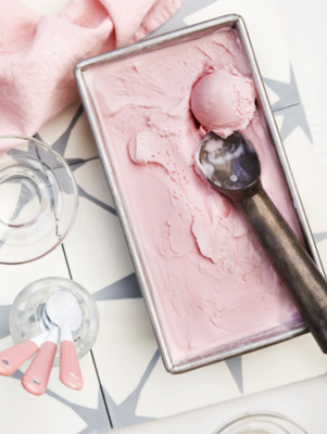 a scoop of ice cream in a pan with a spoon