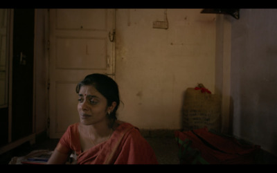 a woman sitting on the floor in a room