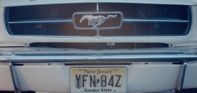 a close up of a mustang emblem on a car