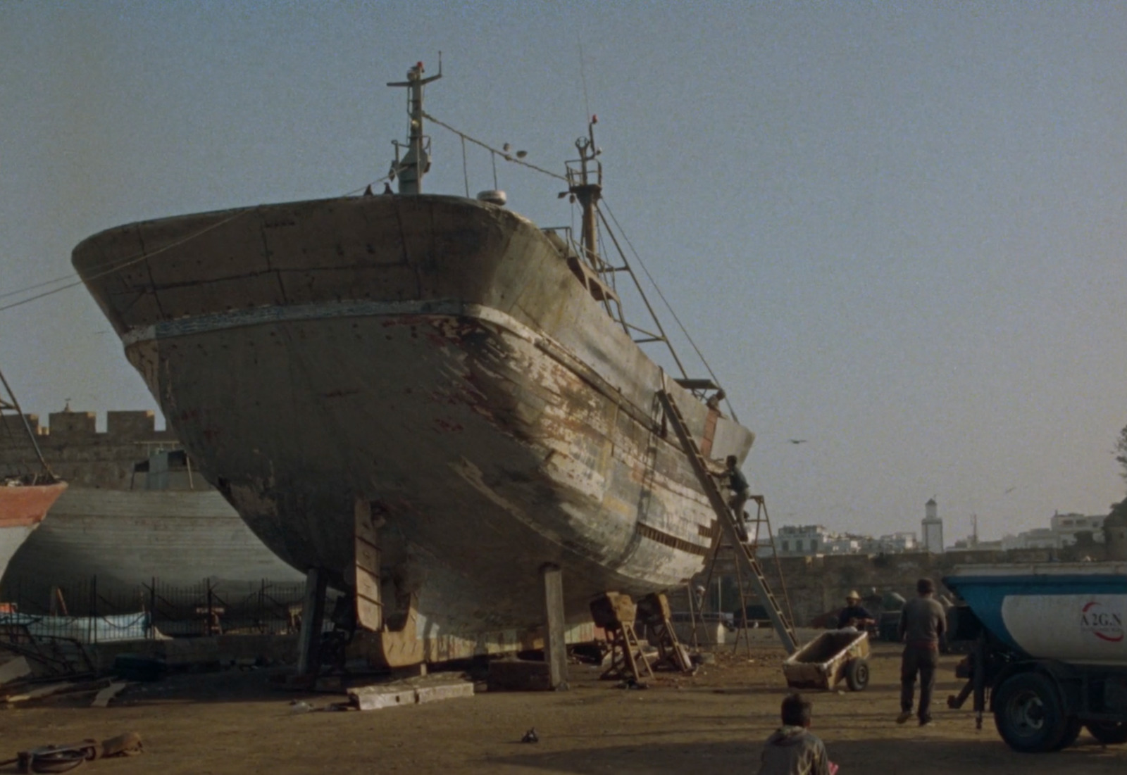 a large boat sitting on top of a dry dock