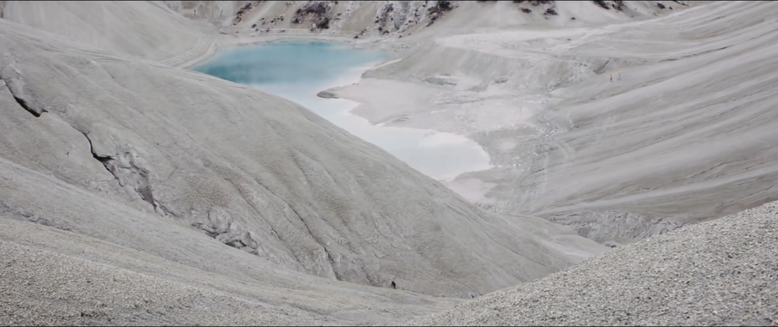 a mountain with a lake in the middle of it