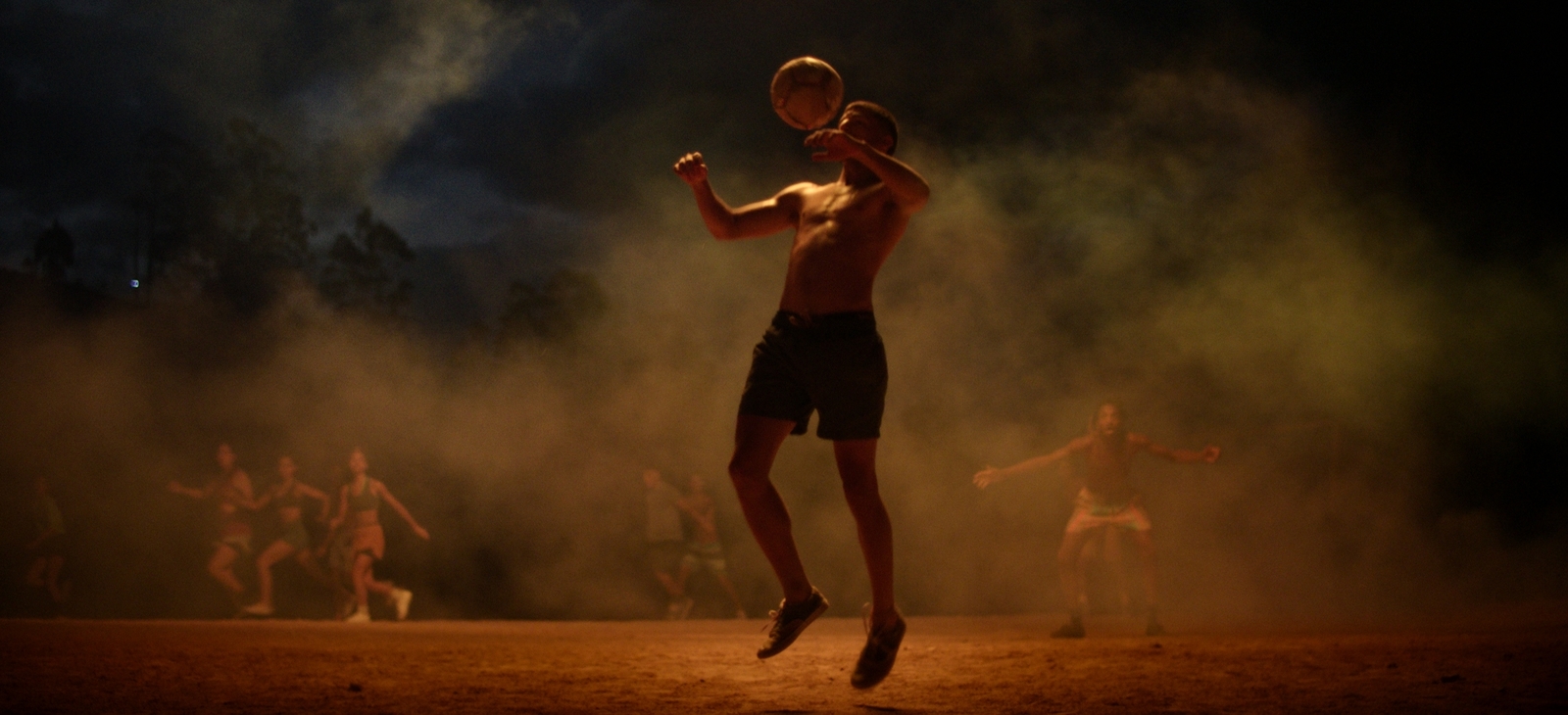 a man is jumping in the air with a frisbee