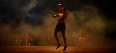 a man is jumping in the air with a frisbee