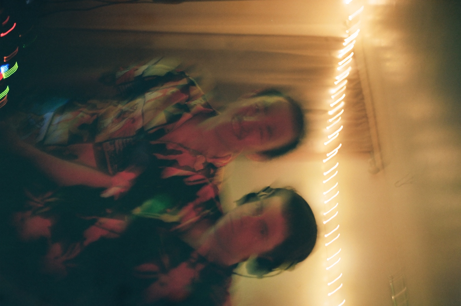 a blurry photo of two people in a room