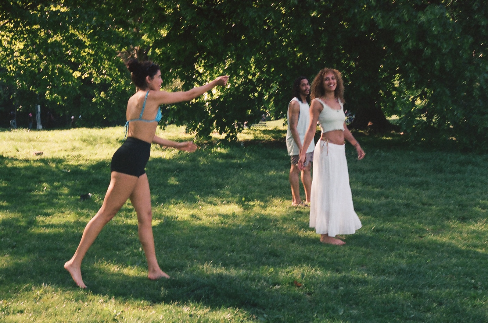 a group of young women playing a game of frisbee