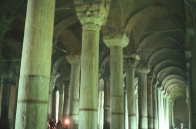 a group of people standing in a large building