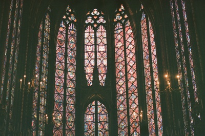 a large stained glass window inside of a building