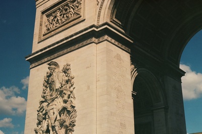 a tall clock tower with a clock on each of it's sides