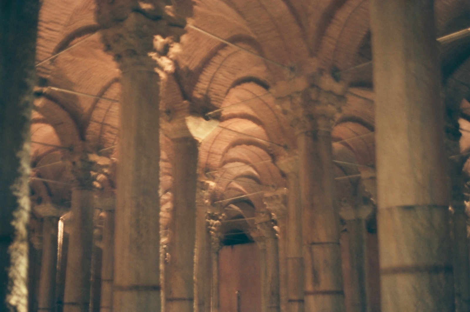 a large building with many pillars and arches