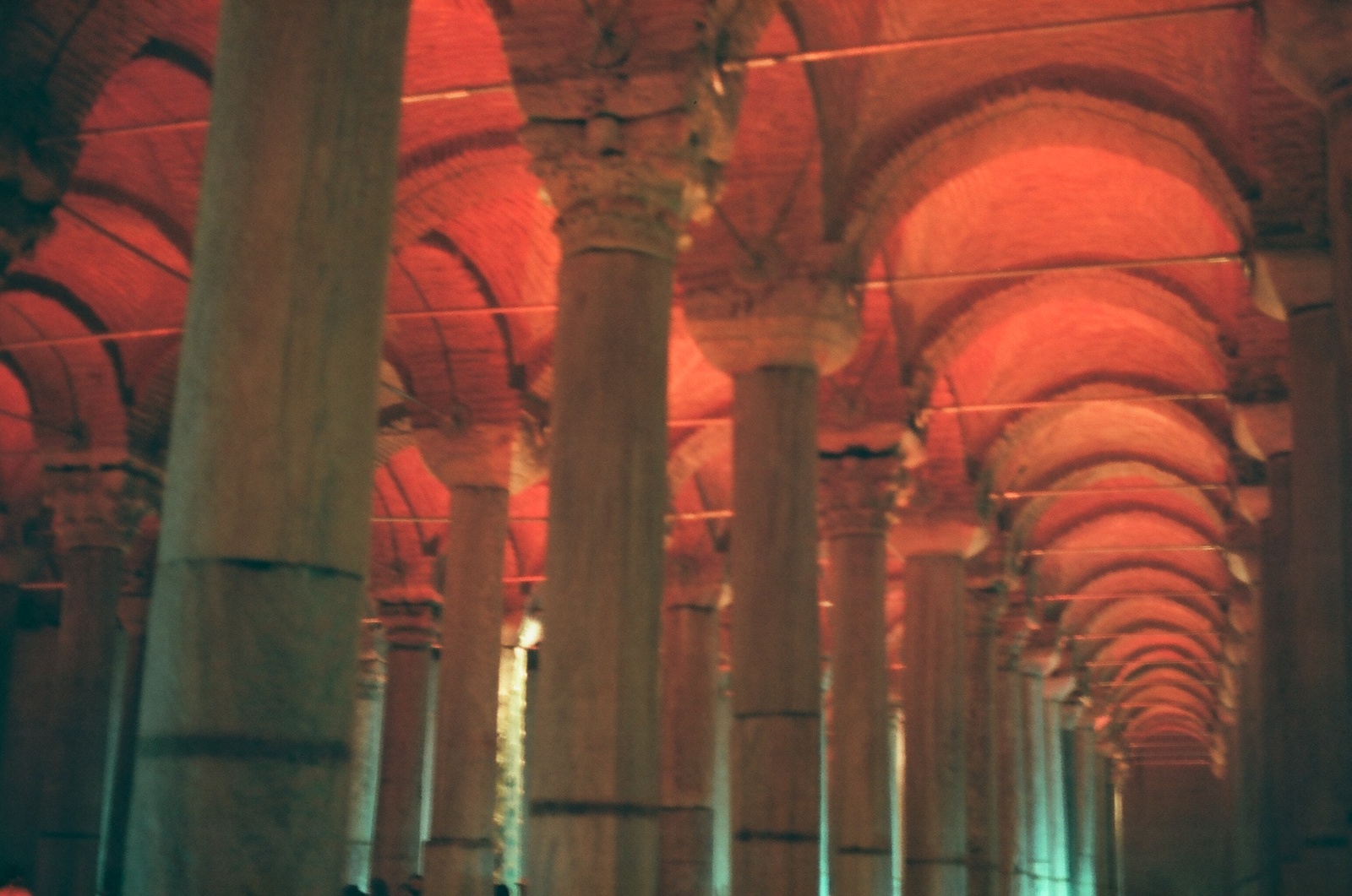 a group of people standing in a large building