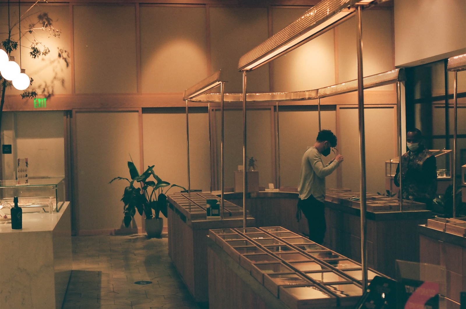 a man standing in front of a counter in a store