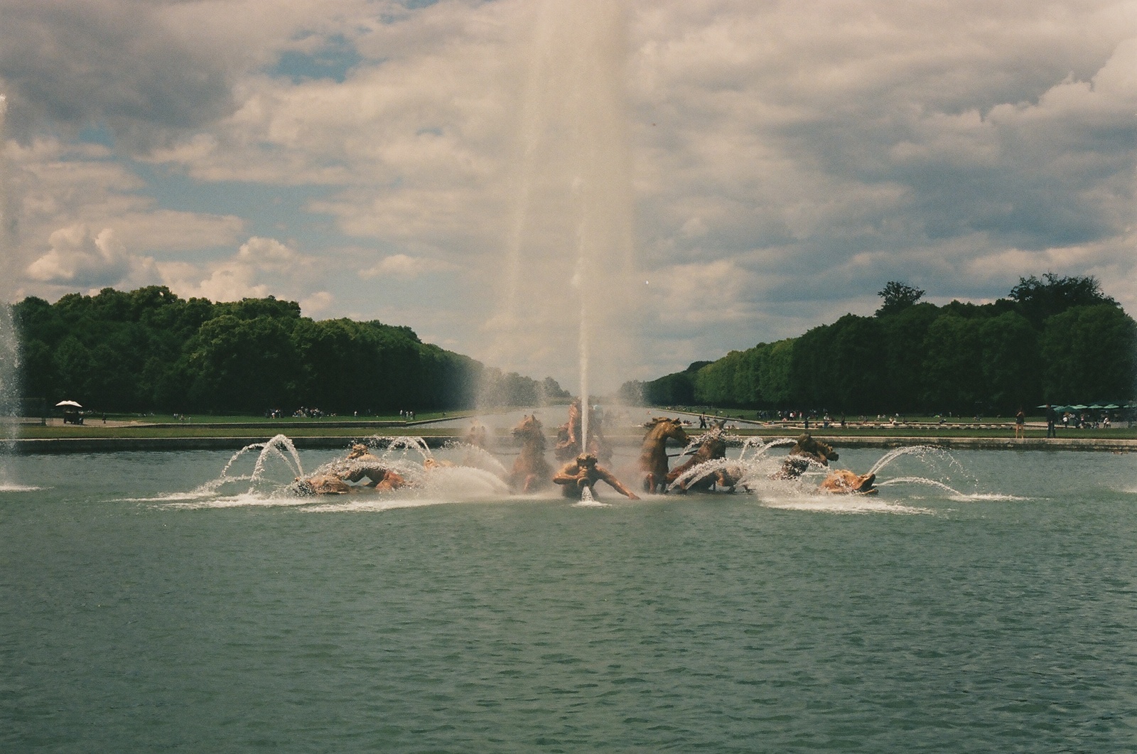 a group of people riding jet skis on top of a lake