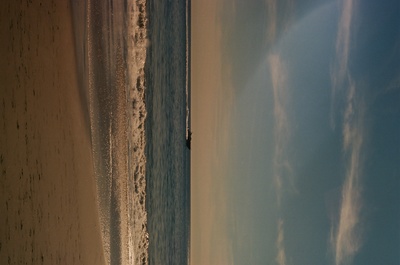 a view of a beach with a boat in the water