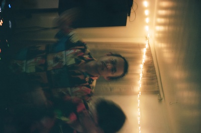 a man standing in front of a tv in a living room