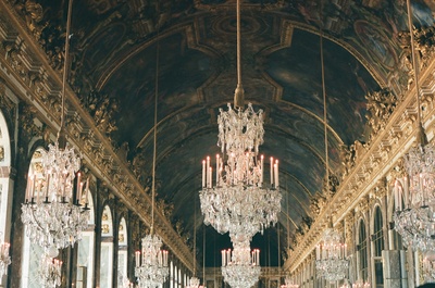 a chandelier hanging from the ceiling of a hall