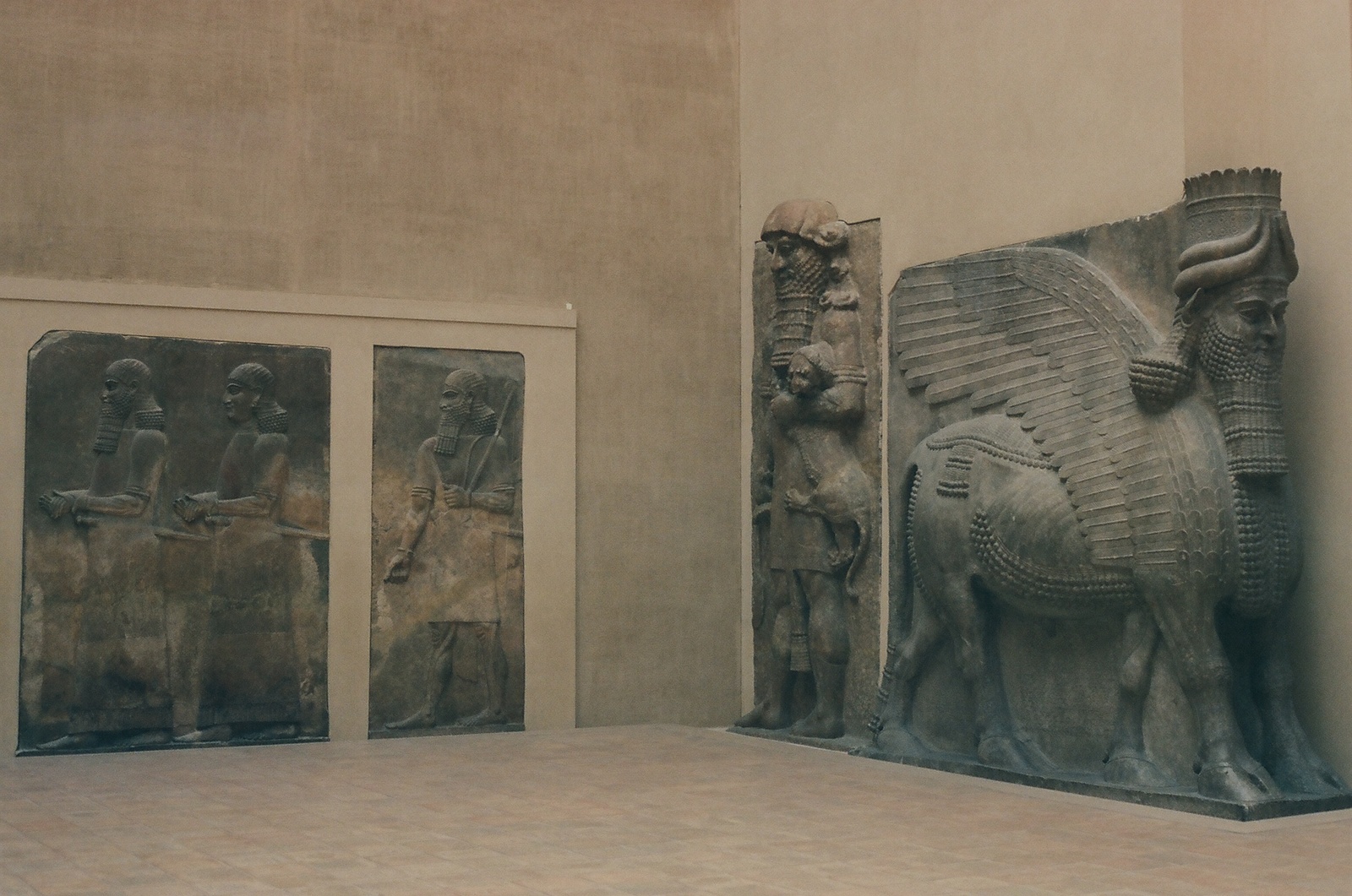 a statue of a bull and a horse in a museum