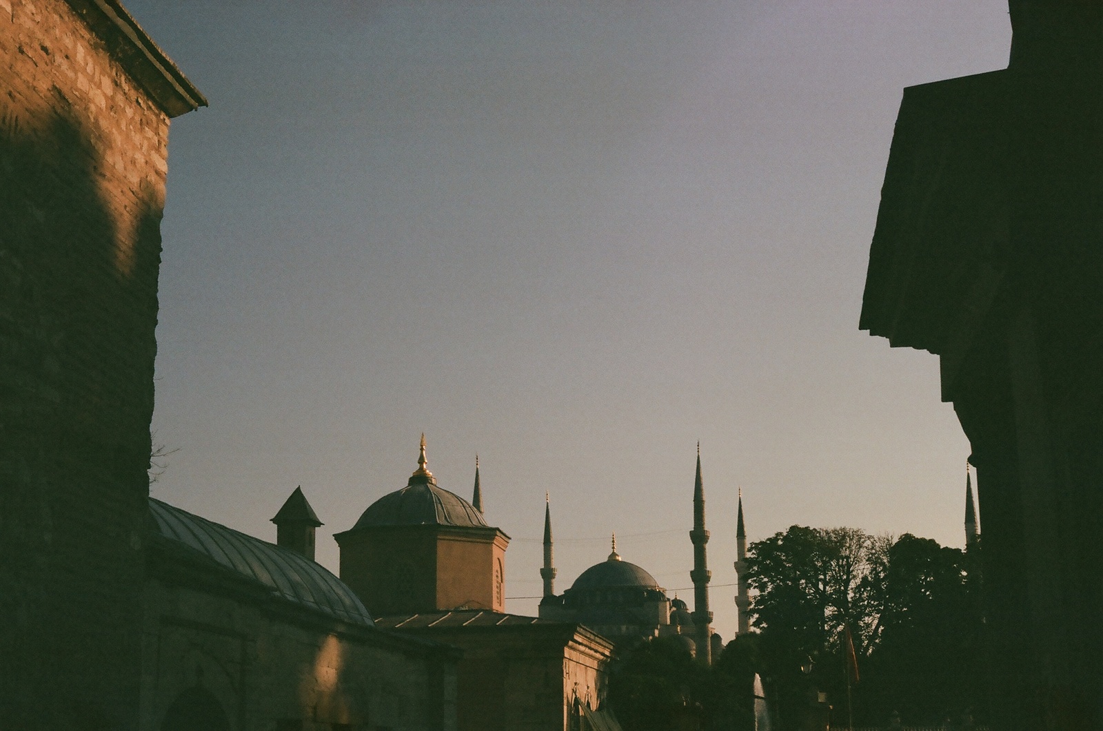 a view of a building with a clock tower in the background