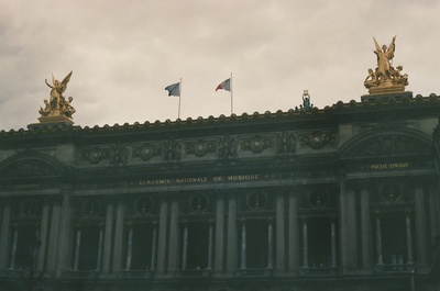 a building with two flags on top of it