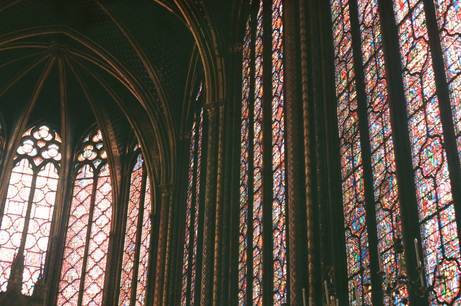 a group of stained glass windows in a cathedral