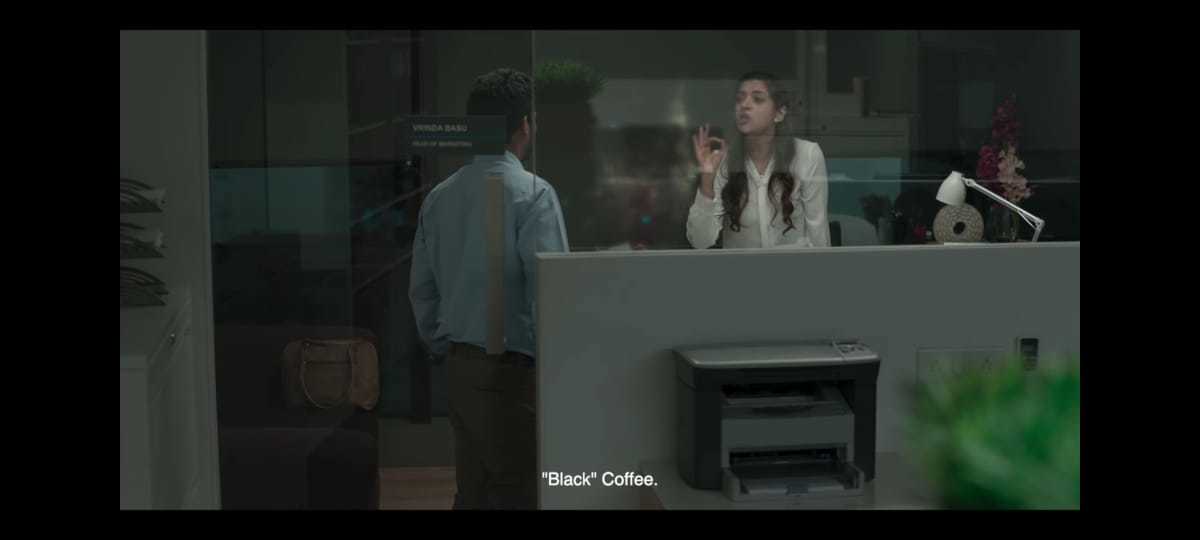 a man and a woman standing at a counter