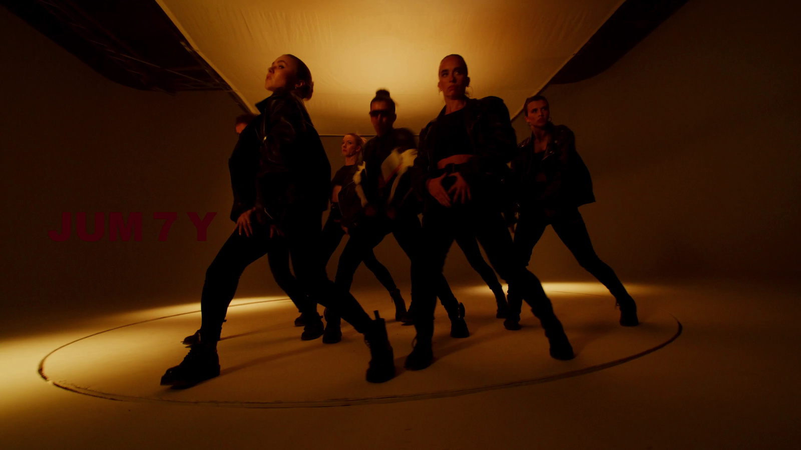 a group of women standing in a circle