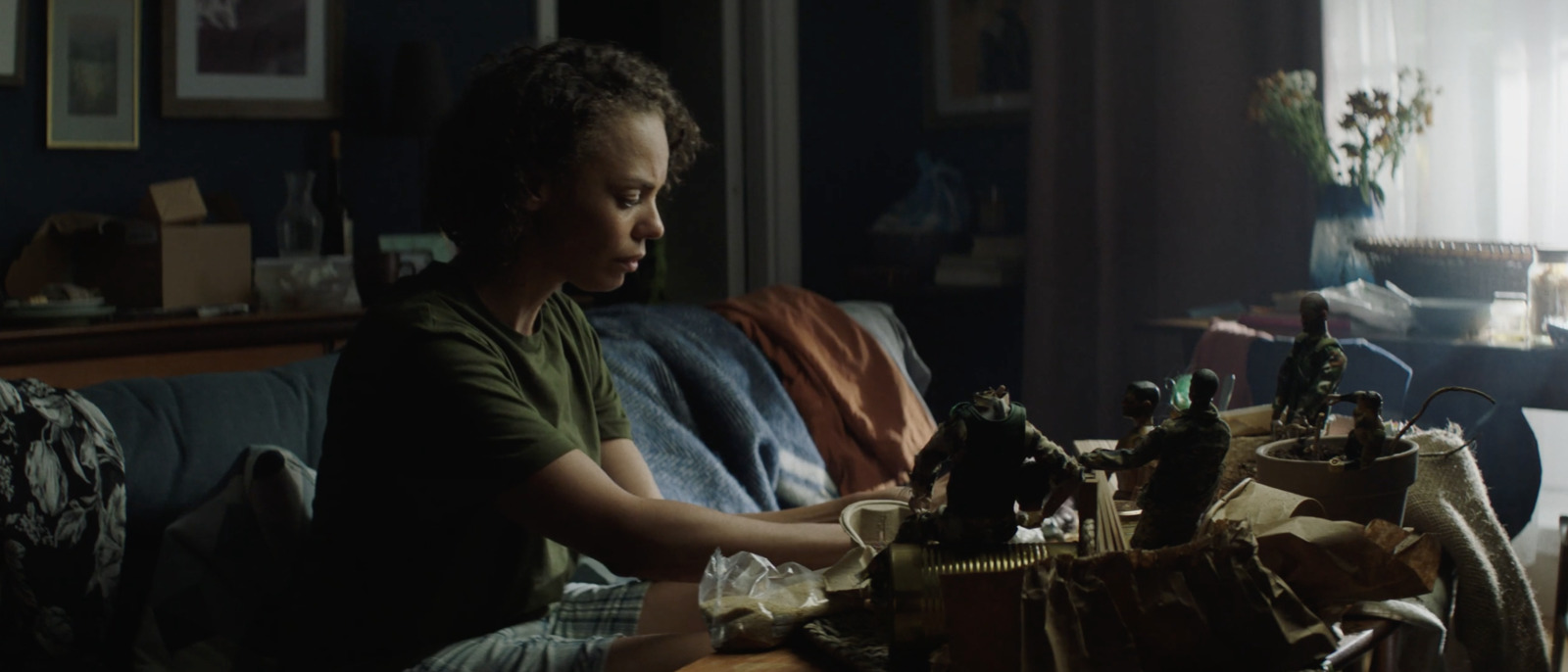 a young boy sitting on a couch in a living room