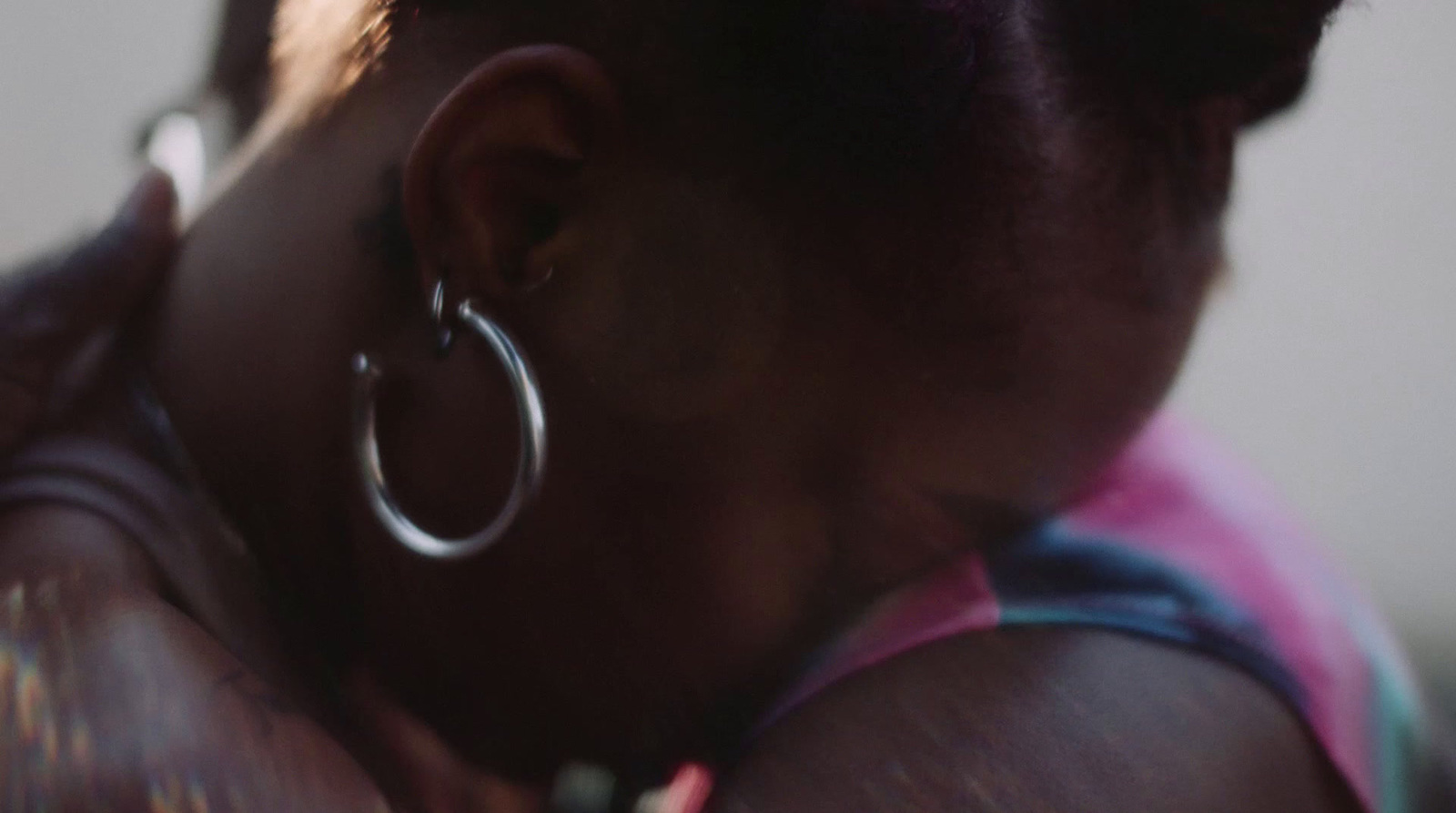 a close up of a person with large hoop earrings