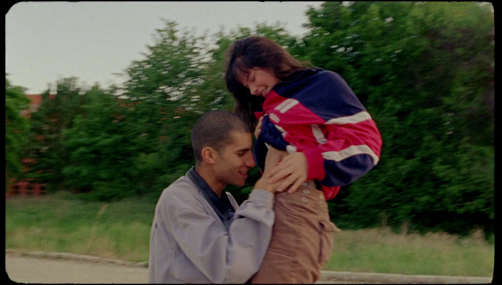 a man holding a woman on his shoulders