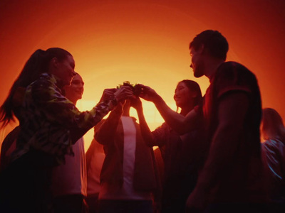 a group of people standing around each other