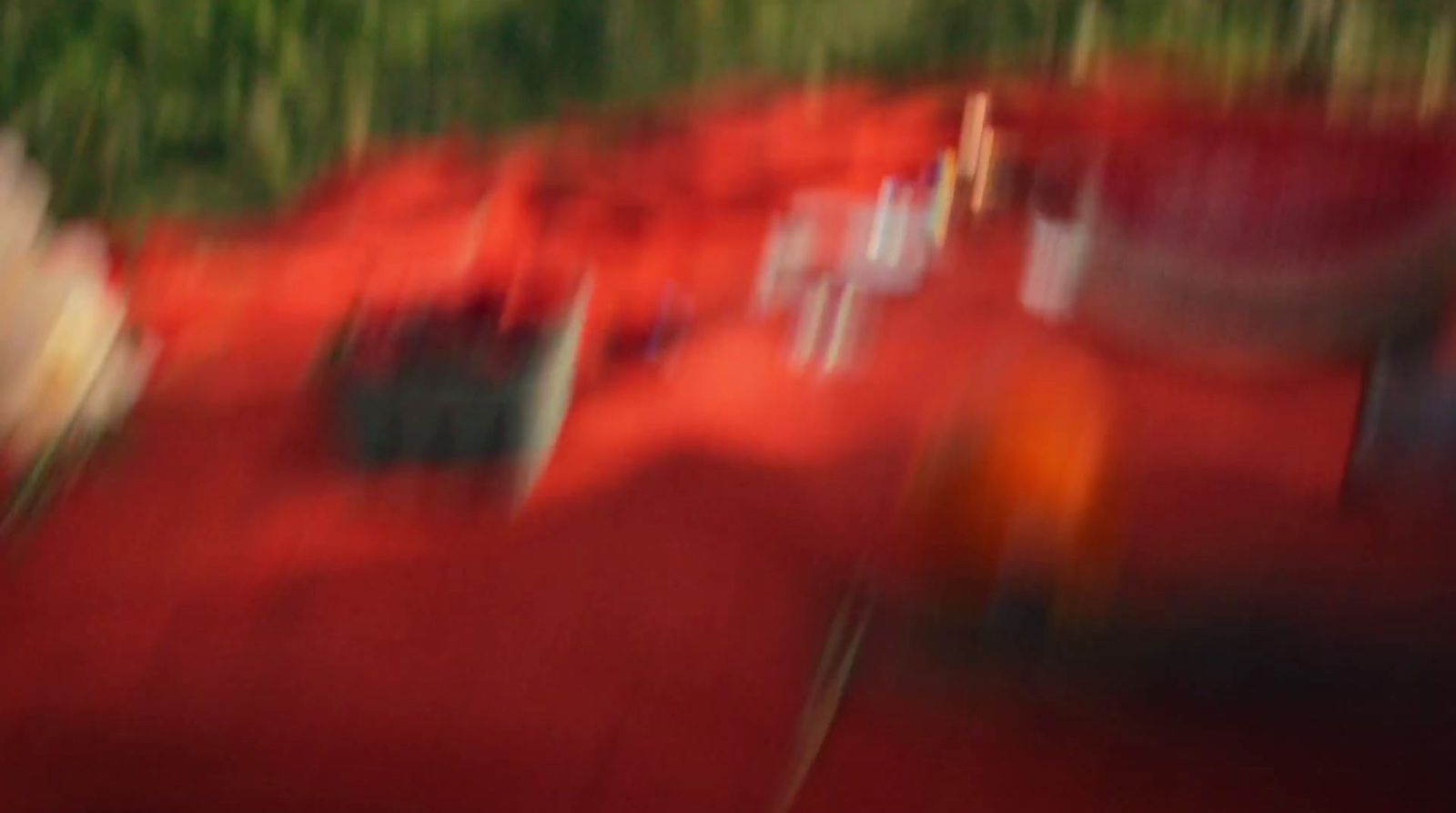 a blurry photo of a group of people on a red carpet