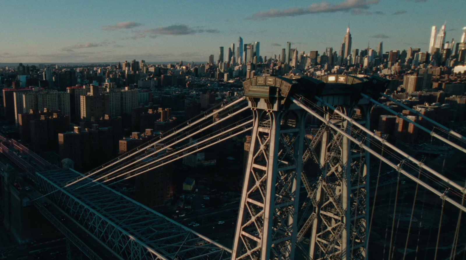 an aerial view of a city and a bridge