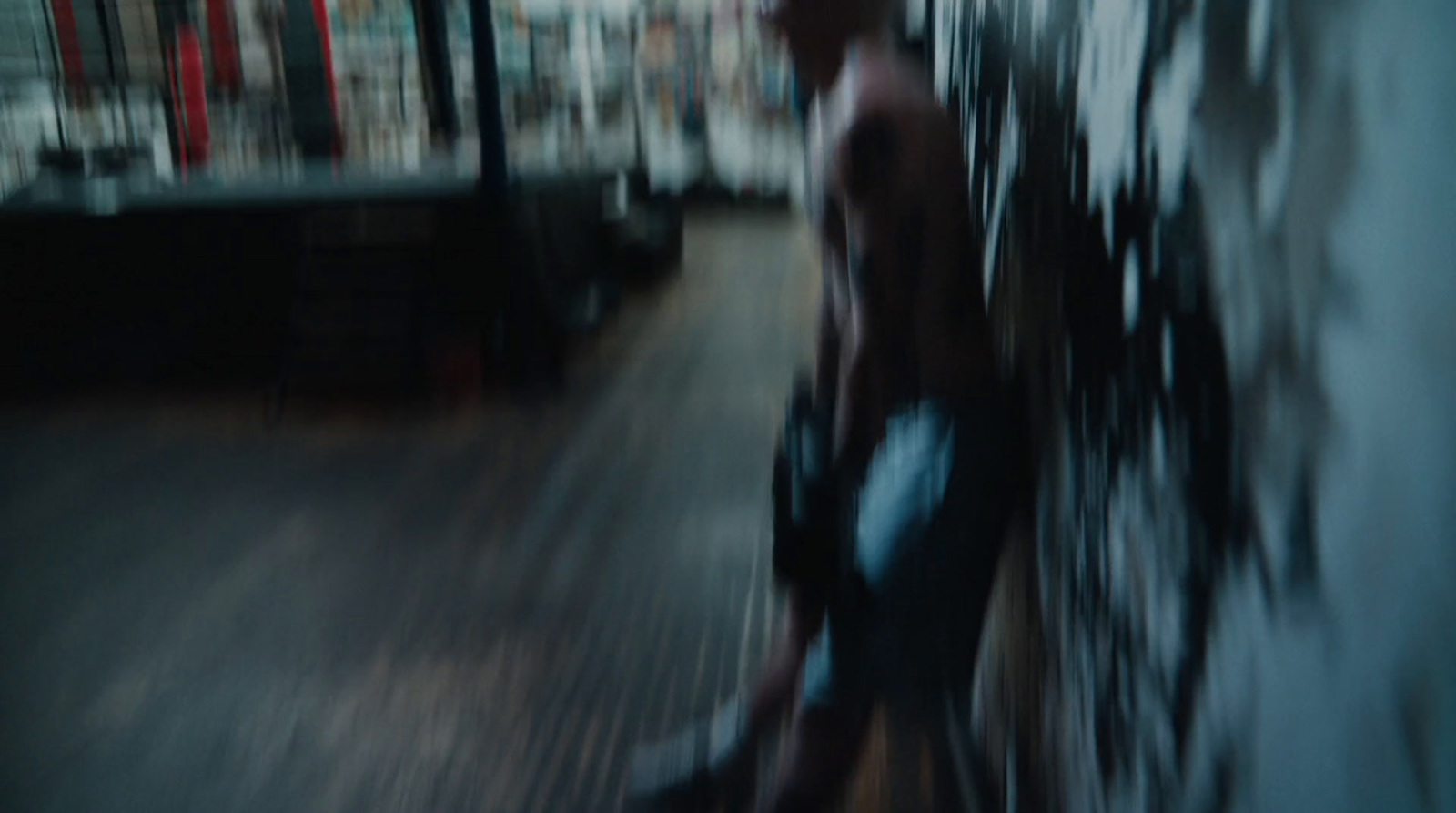 a blurry photo of a man walking down a street