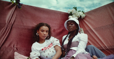 a couple of women sitting next to each other