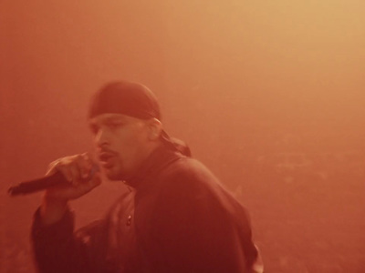 a man standing on a stage holding a microphone