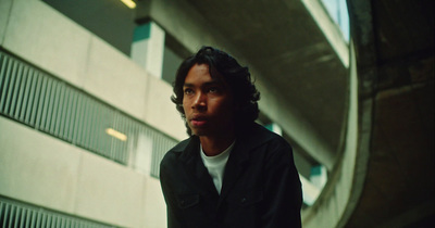 a man standing in front of a building