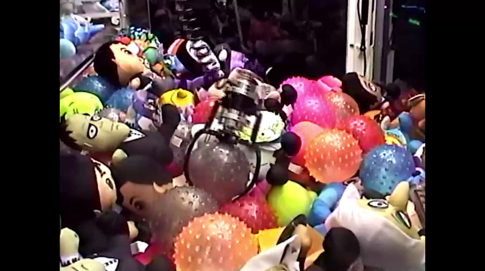 a bunch of stuffed animals and balloons in a store